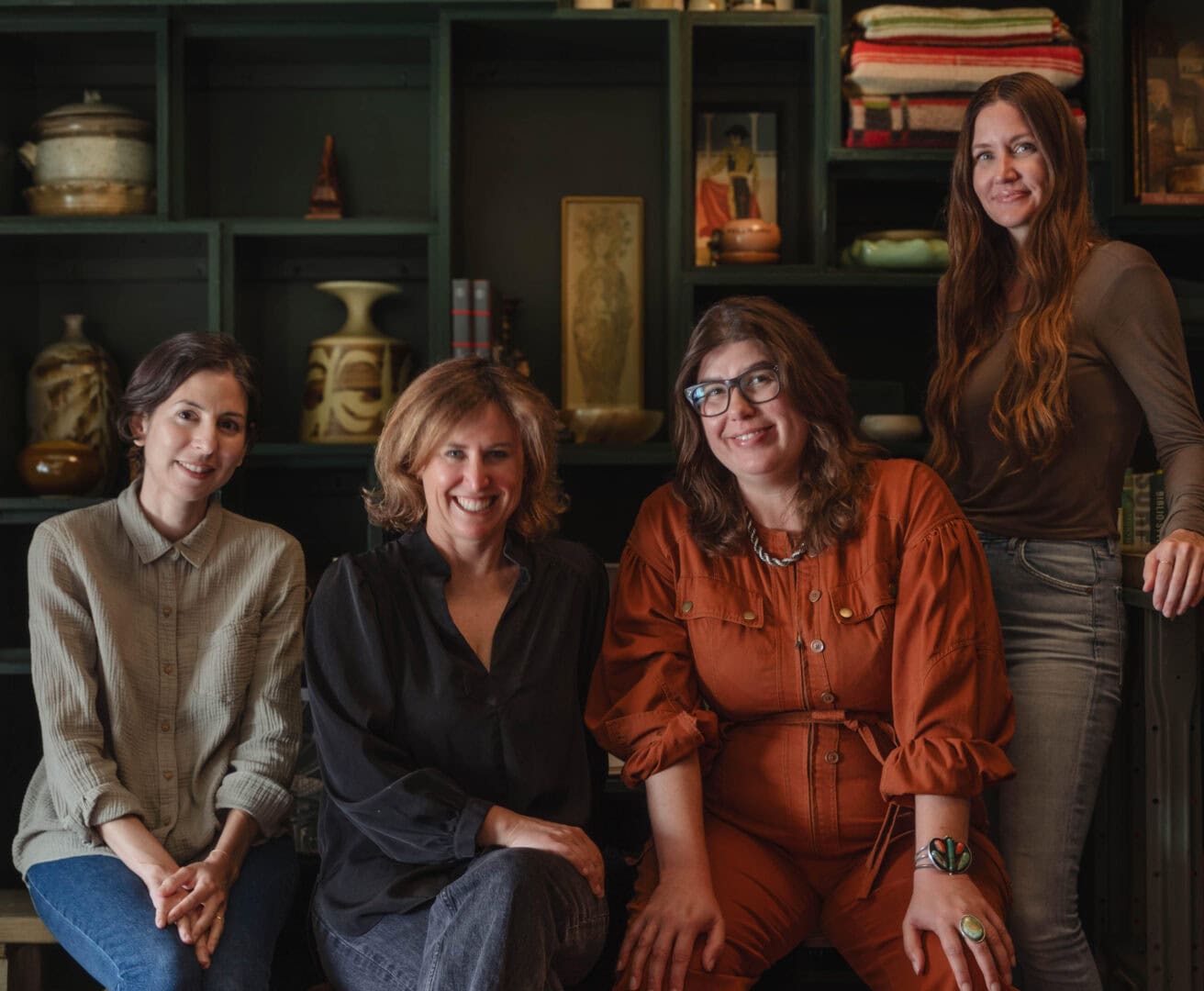 Four members of the HearthLA realty team pose together inside a Los Angeles home.